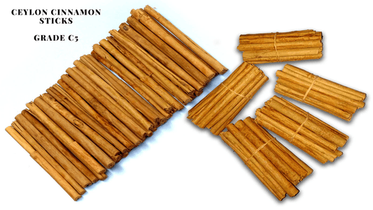 Multiple bundles of cinnamon sticks, including Ceylon cinnamon and Chinese cassia, arranged on a white background for comparison
